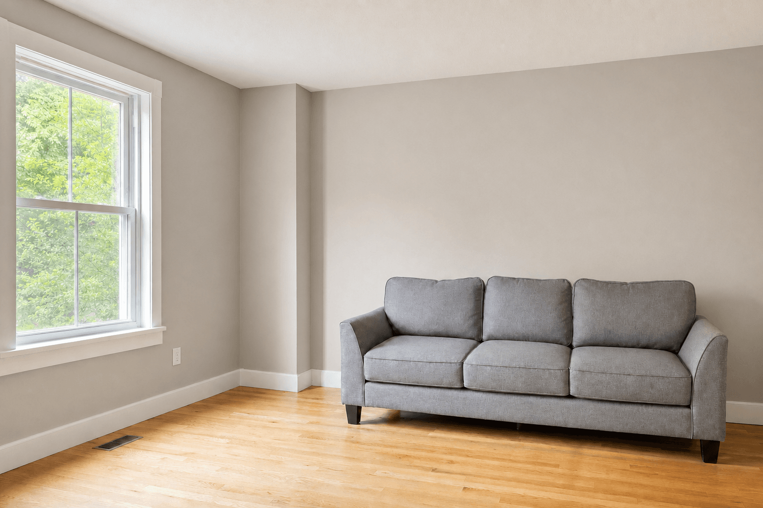 The AI concept of the same room, with a soft greige wall.